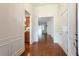 Inviting foyer with hardwood floors, decorative molding, and views into other living spaces at 4520 Vanadium Bnd, Cumming, GA 30040