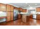 Modern kitchen featuring stainless steel appliances, granite countertops, and a kitchen island at 4520 Vanadium Bnd, Cumming, GA 30040