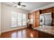 Eat-in kitchen area with stainless steel appliances, a granite counter and a built in desk area at 4520 Vanadium Bnd, Cumming, GA 30040
