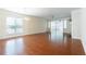 Bright living room with hardwood floors, large windows, and elegant lighting at 4520 Vanadium Bnd, Cumming, GA 30040