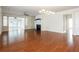 Spacious living room with hardwood floors, fireplace, and open layout, perfect for gatherings at 4520 Vanadium Bnd, Cumming, GA 30040