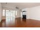 Comfortable living room with hardwood floors and a white fireplace, with lots of room at 4520 Vanadium Bnd, Cumming, GA 30040