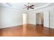 Main bedroom with hard wood floors, trey ceiling, and multiple entrance doors at 4520 Vanadium Bnd, Cumming, GA 30040