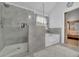 Modern bathroom showcasing a glass shower, soaking tub, and contemporary design at 5085 Mundy Dr, Cumming, GA 30028