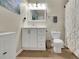 Cozy bathroom with modern fixtures, tile flooring, and white cabinets with storage at 5085 Mundy Dr, Cumming, GA 30028