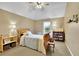 Cozy bedroom with natural light, comfortable bed, display shelves, and a calming ambiance at 5085 Mundy Dr, Cumming, GA 30028