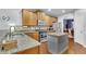 Bright kitchen featuring stainless steel appliances, wooden cabinets and granite countertops at 5085 Mundy Dr, Cumming, GA 30028