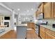 Bright kitchen featuring stainless steel appliances, wooden cabinets and granite countertops at 5085 Mundy Dr, Cumming, GA 30028