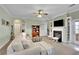 Comfortable living room featuring a fireplace, built-in shelves, and plush seating at 5085 Mundy Dr, Cumming, GA 30028