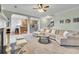 Spacious living room with an open floor plan, seamlessly connecting the kitchen and living areas at 5085 Mundy Dr, Cumming, GA 30028