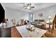 Cozy living room with hardwood floors, comfortable seating, and ample natural light at 5085 Mundy Dr, Cumming, GA 30028