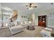 Inviting living room with a cozy couch, natural light, and a warm, neutral color scheme at 5085 Mundy Dr, Cumming, GA 30028