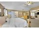 Spacious main bedroom featuring sitting area, ensuite, vaulted ceilings, and serene decor at 5085 Mundy Dr, Cumming, GA 30028