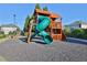 Community playground featuring a slide, climbing structure, and wood chip ground at 5085 Mundy Dr, Cumming, GA 30028