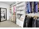 Organized walk-in closet with ample shelving and hanging space for clothing and accessories at 5085 Mundy Dr, Cumming, GA 30028