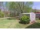 Backyard featuring a storage shed and potential space for outdoor activities at 660 Hembree Rd, Roswell, GA 30076
