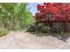 Fenced-in backyard featuring a covered porch at 660 Hembree Rd, Roswell, GA 30076