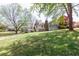 Expansive backyard with mature trees and a screened-in porch, perfect for outdoor entertaining at 660 Hembree Rd, Roswell, GA 30076
