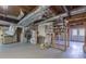Unfinished basement featuring utility connections, framing, and storage opportunities at 660 Hembree Rd, Roswell, GA 30076