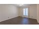 Bedroom with hardwood floors, natural light, and neutral walls at 660 Hembree Rd, Roswell, GA 30076