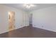 Bedroom with hardwood floors and double closets; bathroom access at 660 Hembree Rd, Roswell, GA 30076