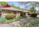 Charming exterior featuring stone accents, lush landscaping, and a welcoming walkway at 660 Hembree Rd, Roswell, GA 30076