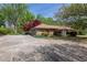 Single-story home with stone facade, attached garage, and concrete driveway at 660 Hembree Rd, Roswell, GA 30076