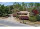 Charming single-story home with mature landscaping and a long driveway at 660 Hembree Rd, Roswell, GA 30076