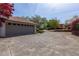 Spacious garage with a large driveway and ample parking space surrounded by landscaped yard at 660 Hembree Rd, Roswell, GA 30076