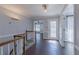 Bright hallway with hardwood floors, leading to other areas of the house at 660 Hembree Rd, Roswell, GA 30076
