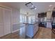 A kitchen featuring an island, stainless steel appliances, and views to the outside at 660 Hembree Rd, Roswell, GA 30076