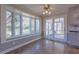 Bright kitchen with a bay window, breakfast nook, white cabinets and door to patio at 660 Hembree Rd, Roswell, GA 30076