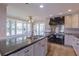 Kitchen with an island, stainless steel appliances and a breakfast nook at 660 Hembree Rd, Roswell, GA 30076