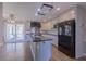 Kitchen featuring an island, stainless steel appliances, and white cabinets at 660 Hembree Rd, Roswell, GA 30076