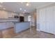 The kitchen features an island, stainless steel appliances, and white cabinets at 660 Hembree Rd, Roswell, GA 30076