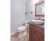 Powder room with decorative vanity, vessel sink, and elegant mirror at 660 Hembree Rd, Roswell, GA 30076