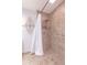 This shower includes tiled walls, a hand held shower and a toiletry rack inside the shower at 660 Hembree Rd, Roswell, GA 30076