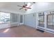 Sunroom with paneled ceiling, unique tiling, and access to the backyard through a glass door at 660 Hembree Rd, Roswell, GA 30076