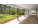 Covered back porch overlooking a lush, green backyard at 1071 N Price Rd, Sugar Hill, GA 30518