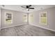 Bright bedroom filled with natural light, featuring neutral walls and wood-look flooring at 1071 N Price Rd, Sugar Hill, GA 30518