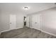 Bedroom with wood-look flooring and view into kitchen at 1071 N Price Rd, Sugar Hill, GA 30518