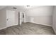 Bonus room featuring open doors leading to a stylish bathroom with hardwood floors at 1071 N Price Rd, Sugar Hill, GA 30518