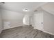 Bonus room featuring a modern ceiling fan, wood flooring and neutral paint at 1071 N Price Rd, Sugar Hill, GA 30518