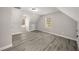 Spacious bonus room with ample natural light and wood-look flooring at 1071 N Price Rd, Sugar Hill, GA 30518