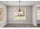 Dining area with natural light, contemporary light fixture and grey flooring at 1071 N Price Rd, Sugar Hill, GA 30518
