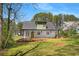 Charming home featuring a cheerful yellow front door at 1071 N Price Rd, Sugar Hill, GA 30518