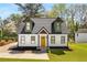 Quaint home showcasing unique architectural features and vibrant landscaping at 1071 N Price Rd, Sugar Hill, GA 30518
