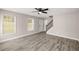 Bright living room showcasing the entrance, staircase, and neutral color palette at 1071 N Price Rd, Sugar Hill, GA 30518