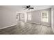 Open living area with ample natural light and gray wood-look flooring throughout at 1071 N Price Rd, Sugar Hill, GA 30518