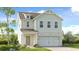 Charming two-story home with a mix of brick and siding, attached two car garage, and inviting front porch at 1375 Windance Lake Dr, Loganville, GA 30052